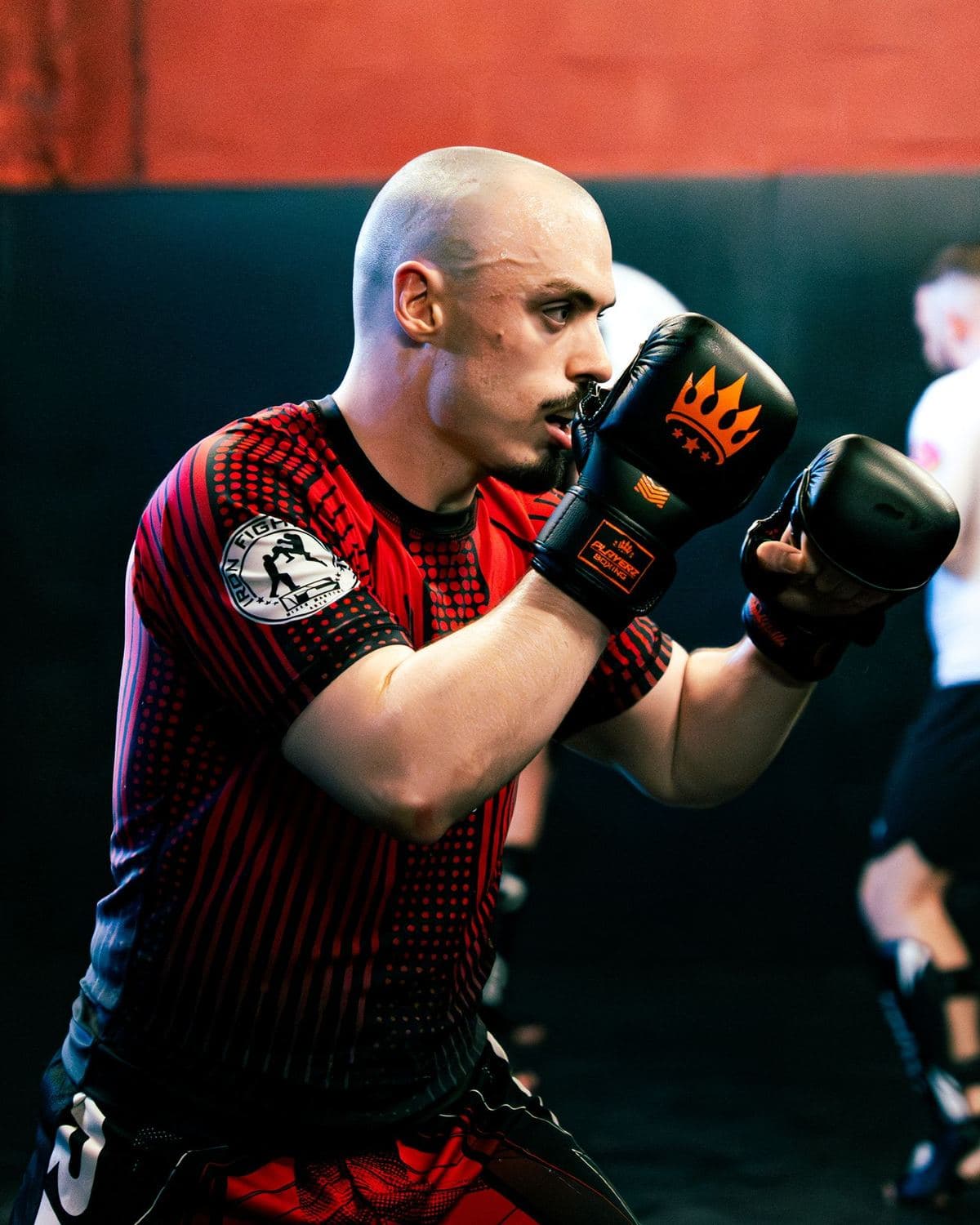 No-gi grappler in a red rashguard training at Iron Fight Club Worcester